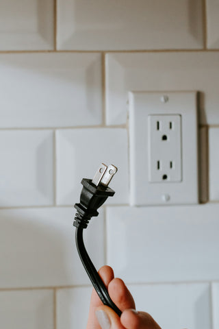 USB cable plugged into a wall socket