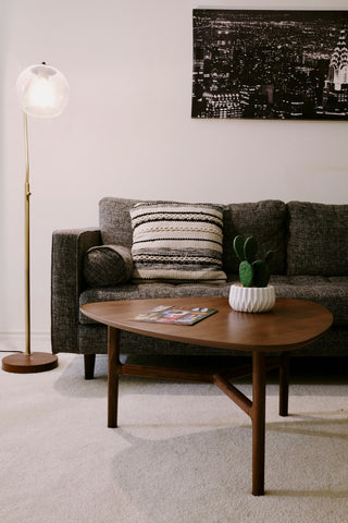 A living room lit by several lamps at different heights rather than one ceiling light