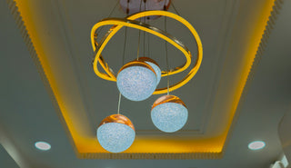 Modern sculptural chandelier with glowing glass spheres