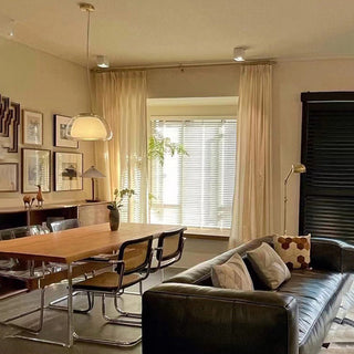 Scandinavian glass pendant over dining table