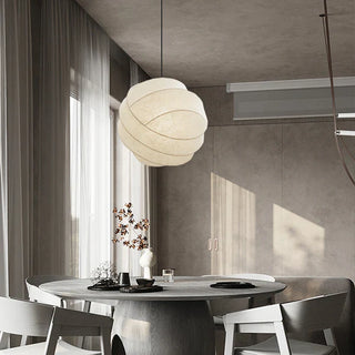 Modern white globe pendant hanging in Scandinavian interior