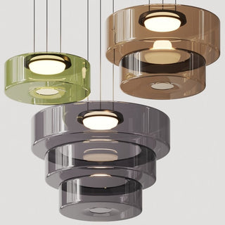 Adjustable modern glass pendant over round dining table