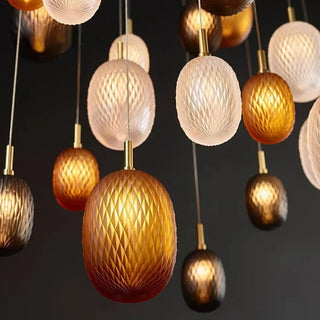 Glass ball pendant lamp detail — stained iron frame ceiling