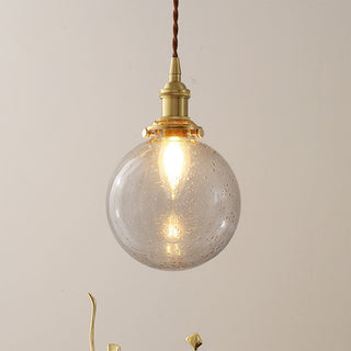 Elegant glass globe lamp with gold accent — black ceiling pendant