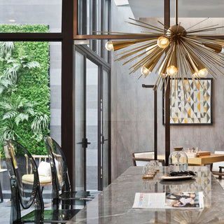 Brass 10-bulb chandelier close-up — mid-century metal detail