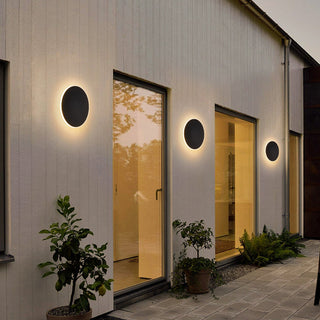 Minimalist outdoor round LED wall lamp illuminated — waterproof metal