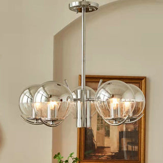 Modern glass silver chandelier side — metal frame space warm