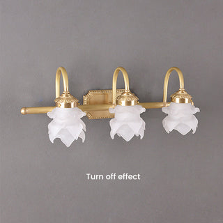 Brass glass gold vanity wall sconce close-up — luxury bathroom