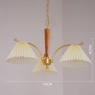 Pleated wood brass chandelier ambient — elegant dining warm glow