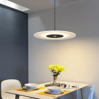 Nordic LED pendant with flat disk form and warm light