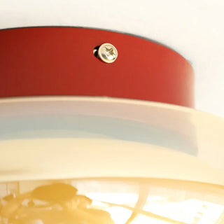 Small vintage ceiling fixture with acrylic shade, warm ambient