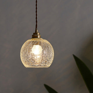 Black gold glass globe pendant from below — elegant ceiling lamp