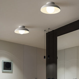 White metal minimalist ceiling light close-up, round clean design