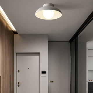 Minimalist round ceiling fixture in living room, white metal