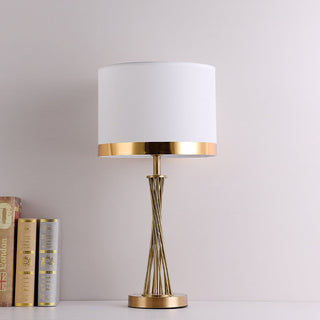 Designer golden lamp side view — modern elegant desk light