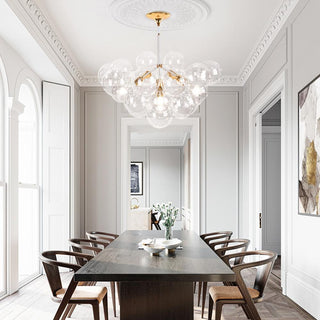 Glass bubble chandelier large warm ambient lighting overhead