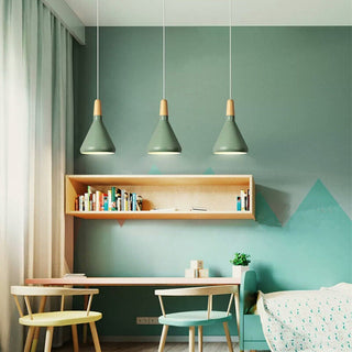 Colorful pendant with conical metal shade over dining table