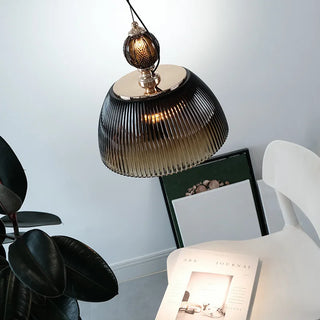 Retro stylish green glass pendant over dining table
