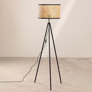 Tall bamboo rattan lamp illuminated — minimalist warm glow