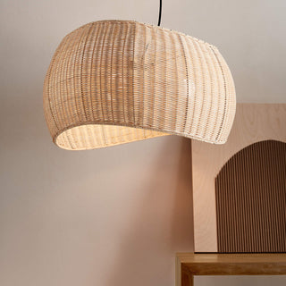 Rattan wicker ceiling lamp casting warm textured shadow