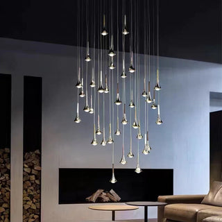 Raindrop glass chandelier casting elegant light pattern