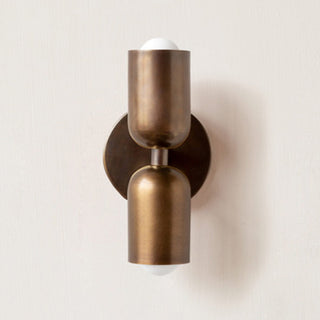 Modern double head copper wall sconce illuminated — elegant