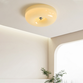 Elegant cream glass ceiling fixture, soft warm glow for bedroom