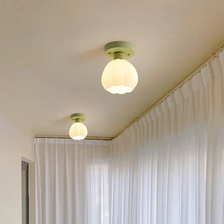 Pumpkin ceiling lamp close-up, modern glass metal mini fixture