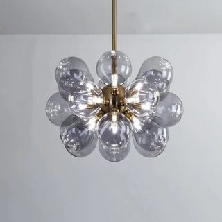 Sputnik bubble chandelier side — glass globe pendant dining warm