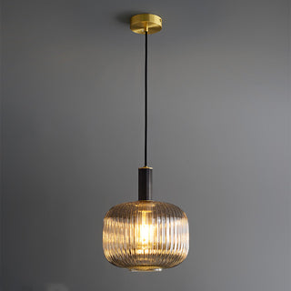 Oval glass pendant close-up — ribbed modern kitchen island lamp