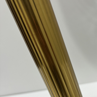 Modern gold lamp wide view — clear glass bedroom warm