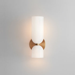 Two bulb glass double head modern wall sconce detail — bedroom
