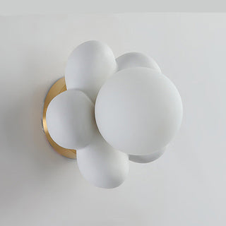 Flower bedside wall sconce in bedroom — pink ceramic lamp