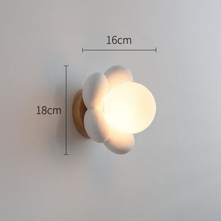 Floral pink ceramic wall sconce detail — bedside ambient lamp