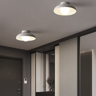 Minimalist ceiling light in living room, round white metal fixture