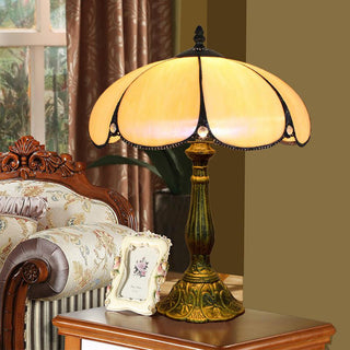 Colorful glass dome lamp illuminated — mid-century warm glow