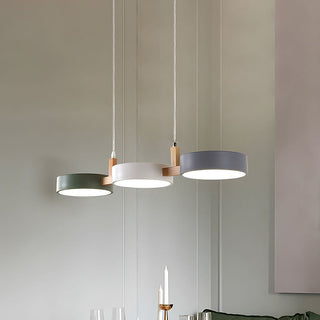 Modern pendant lamp with three heads over dining area