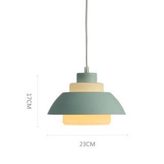 Minimalist dining pendant detail — brushed aluminium hanging lamp