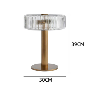 Modern gold glass table lamp illuminated — bedroom warm