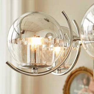 Modern glass silver ball chandelier ambient — metal frame warm
