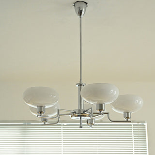 Designer iron medieval chandelier detail — glass warm ambient