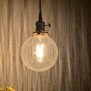 Small globe ceiling lamp side view — black gold finish pendant