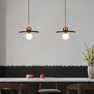 Modern pendant with saucer form — walnut wood and brass globe