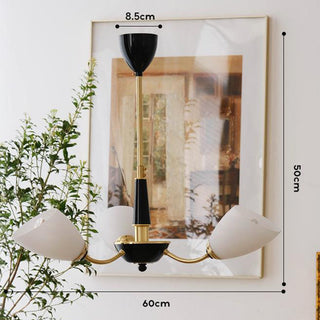 Modern brass black chandelier detail — medieval glass warm texture