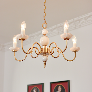 Cream glass chandelier detail — vintage metal soft warm dining