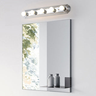 Nordic silver metal vanity wall lamp illuminated — bathroom fixture