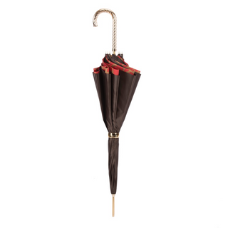 Red giraffe print brass handle luxury women's umbrella close-up handle detail
