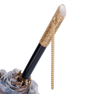 Light gold jeweled handle luxury umbrella canopy detail
