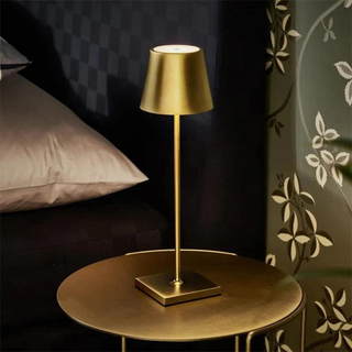 Gold cordless table lamp close-up — waterproof detail