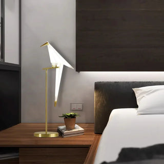 Origami bird table lamp wide view — warm cozy glow